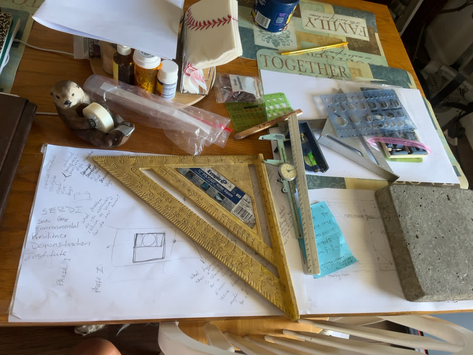 John's worktable with measurements, calculations, drawings and templates